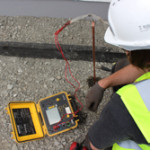 Man checking voltage on meter Direct Strike Ltd accredited lightning protection UK and Ireland